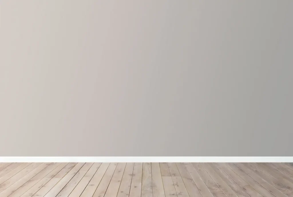 Empty interior wall with wooden flooring and a clean minimalist background