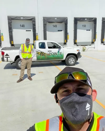 pointe pest control team in a warehouse